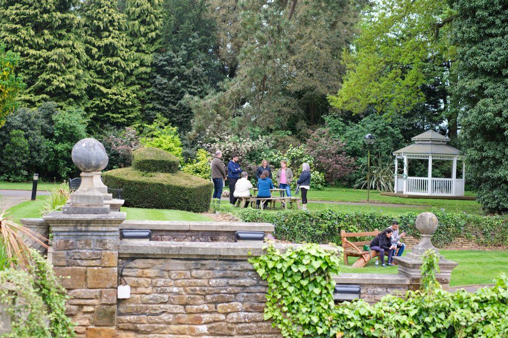 Group of people in large grounds