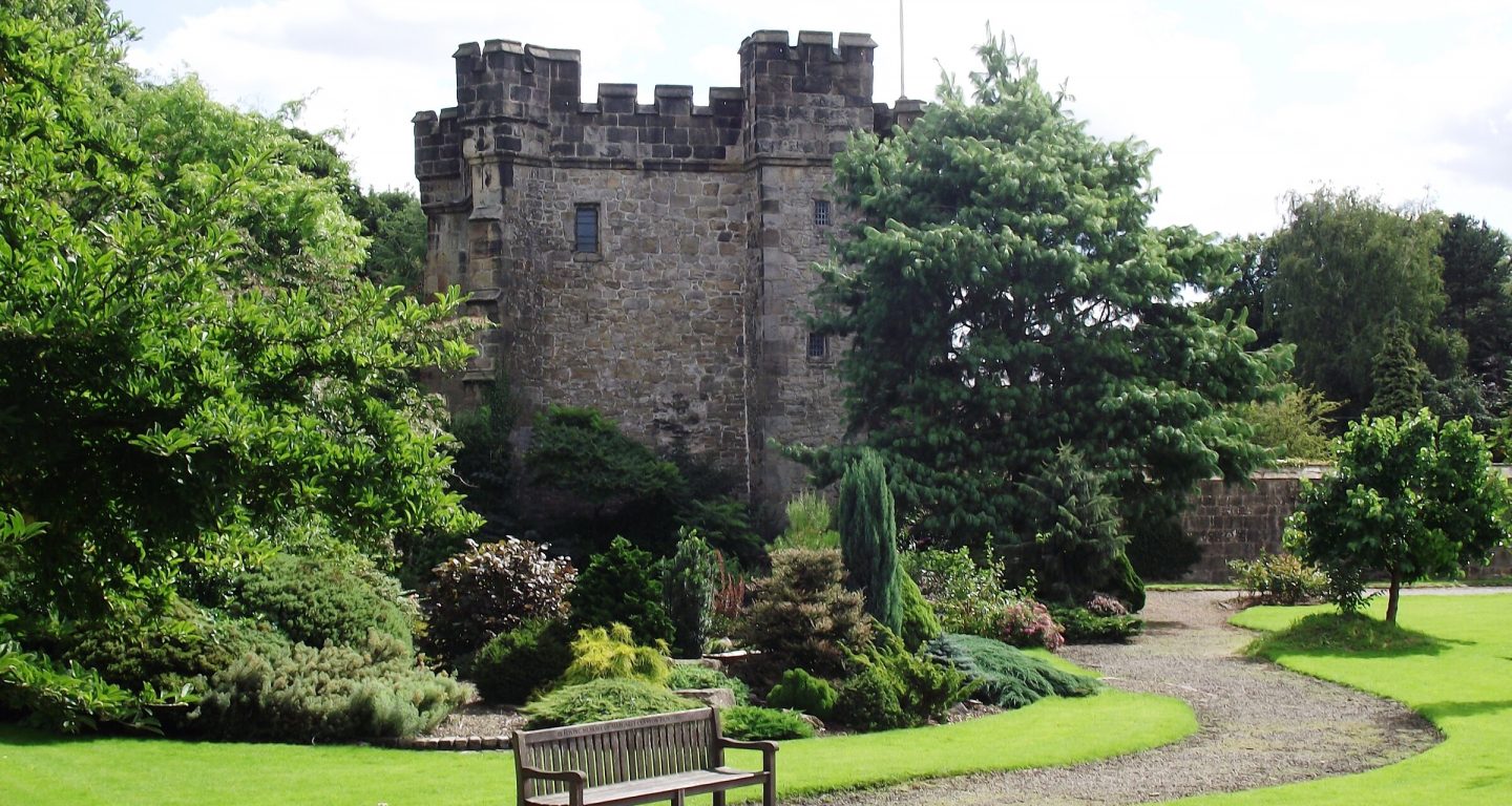 image of whalley abbey in grounds in summer